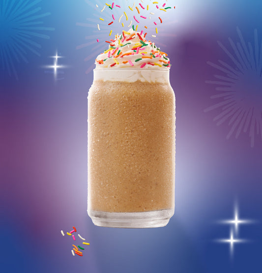 Birthday Cake Granita with sprinkles in a clear glass.