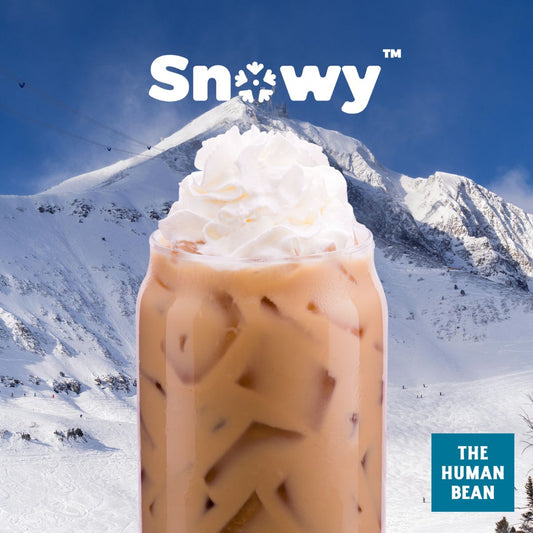 An image depicting The Human Bean's signature Snowy Mocha in front of its original namesake, Mt. Ashland. 