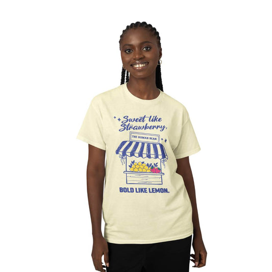 Woman wearing a cream t-shirt with a graphic and text on a white background