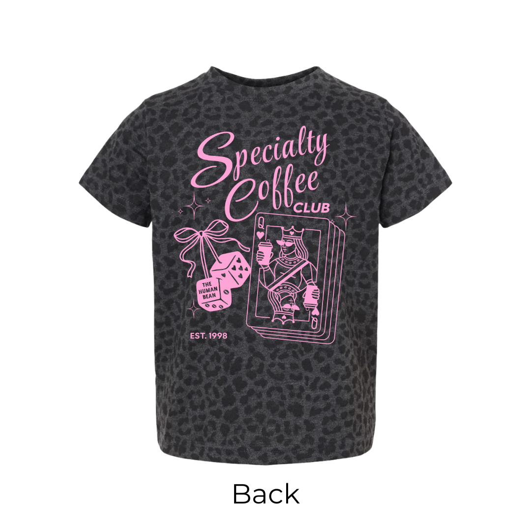 Black t-shirt with pink 'Specialty Coffee Club' text and graphics on a leapord background