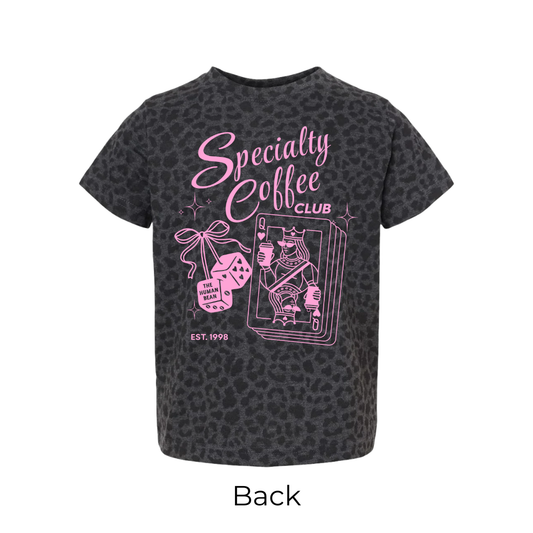 Black t-shirt with pink 'Specialty Coffee Club' text and graphics on a leapord background