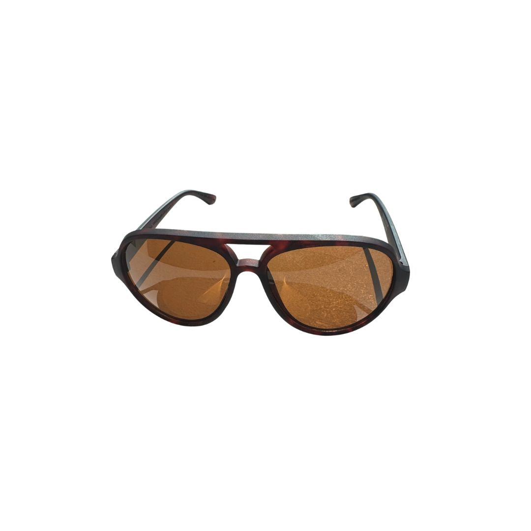 Sunglasses with tortoiseshell frame and brown lenses on a white background