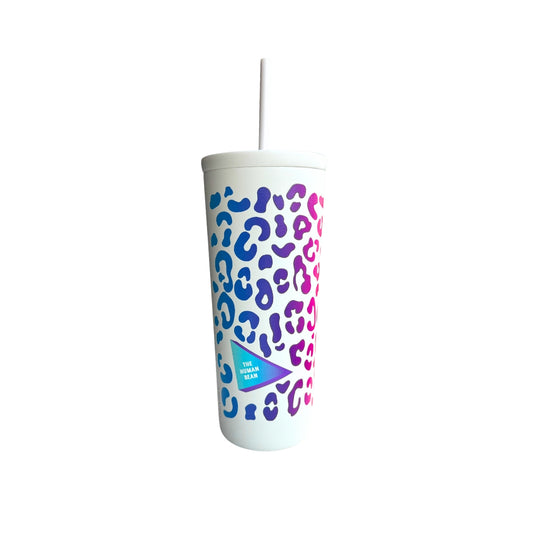 White tumbler with blue and pink leopard print pattern on a white background